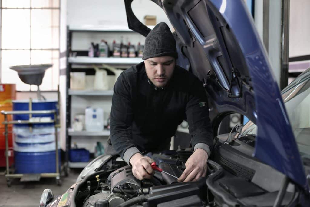 Government Decides to Maintain Current MOT Testing Frequency for New Cars Man in Black Jacket and Black Knit Cap Standing Near Vehicle
