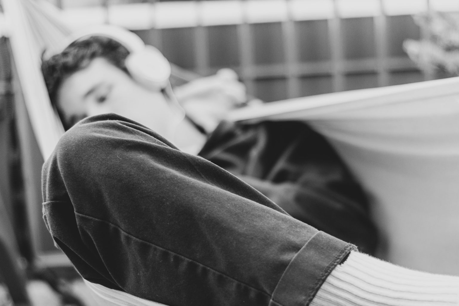 Struggling to sleep? Data reveals the 10 songs that beat insomnia  man on hammock swing