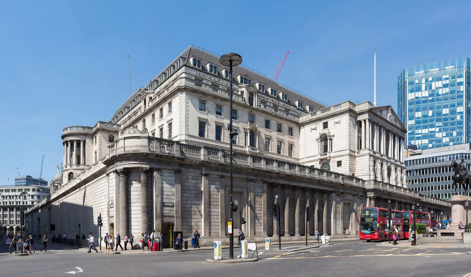 Bank of England building in London framing UK inflation forecast charts for 2026.
