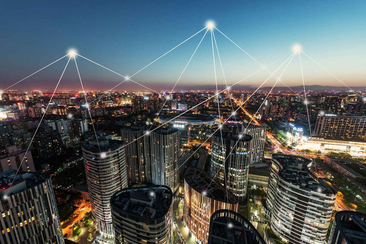 UK Digital Transformation: Why British Companies Are Scaling Technology Investment Modern corporate skyscraper in the City of London financial district with digital connectivity overlay. UK digital transformation trends
