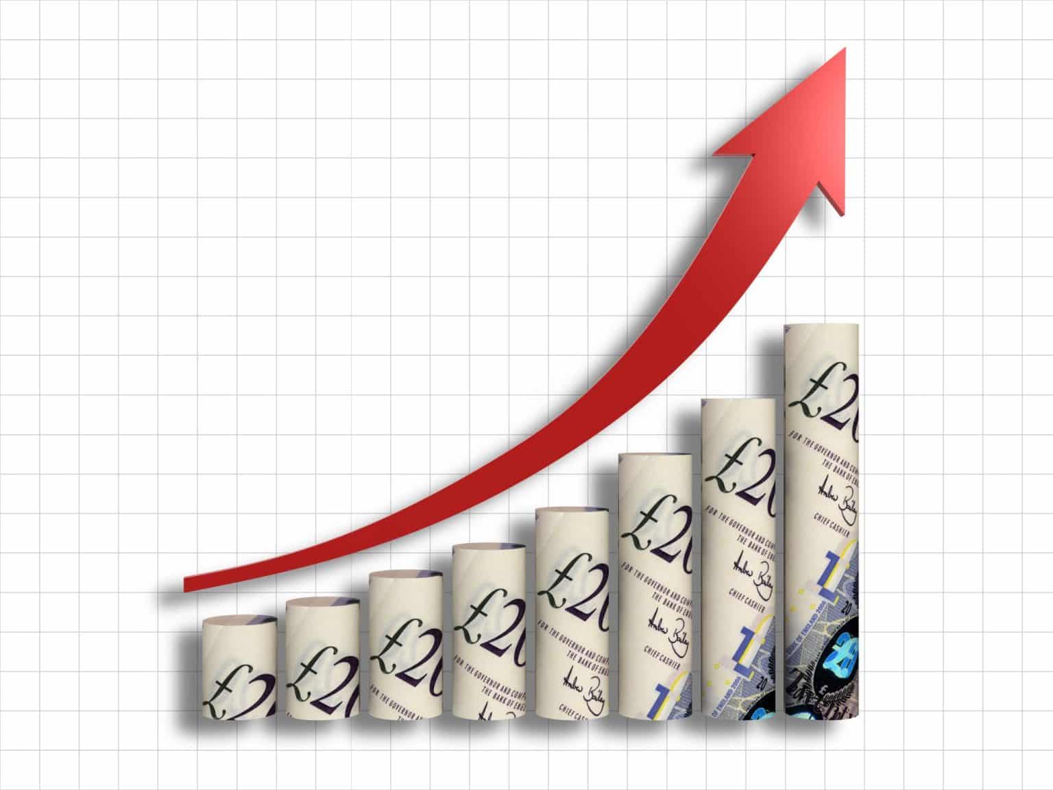 UK Wage Growth 2026: Are Salaries Keeping Up With Inflation? British Pound sterling currency stacked next to an economic growth chart illustrating UK wage trends.